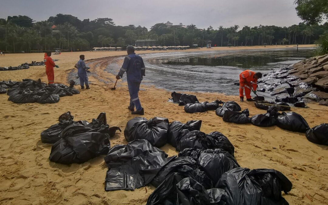 Singapore rushes to clean-up oil slick after boat hits stationary fuel ship